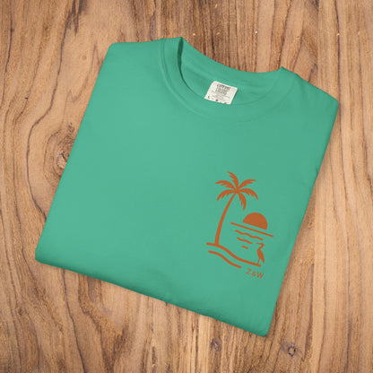 Front view of the Unisex Sunset Palm Tree T-Shirt in a fresh green color, with a unique palm tree and sunset design, great for vibrant summer fashion.
