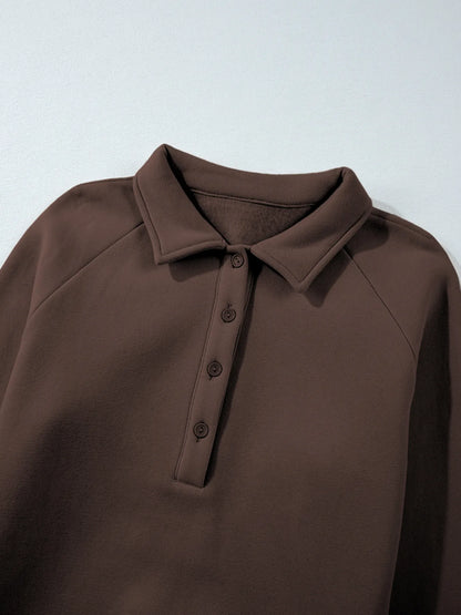 Close-up of the collar of the Trendsi Collared Sweatshirt from the Two-Piece Active Set, showcasing button details and soft fabric texture.