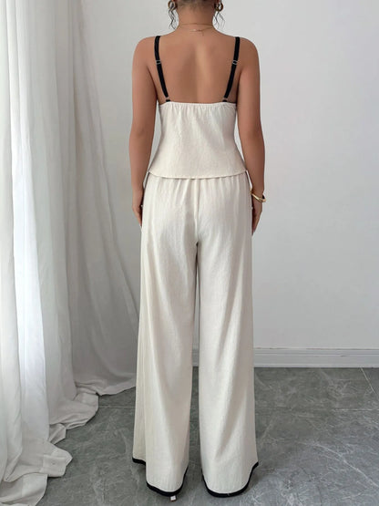 Back view of the Trendy 2-Piece Tie Front Cami and Pocketed Pants Set, emphasizing the fitted cami and airy wide-leg pants, crafted with 100% cotton.