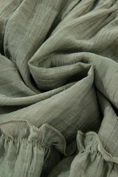 Detailed image of the fabric texture and folded ruffles of the Textured Tie Waist Ruffle Hem Shorts, highlighting softness and versatility.