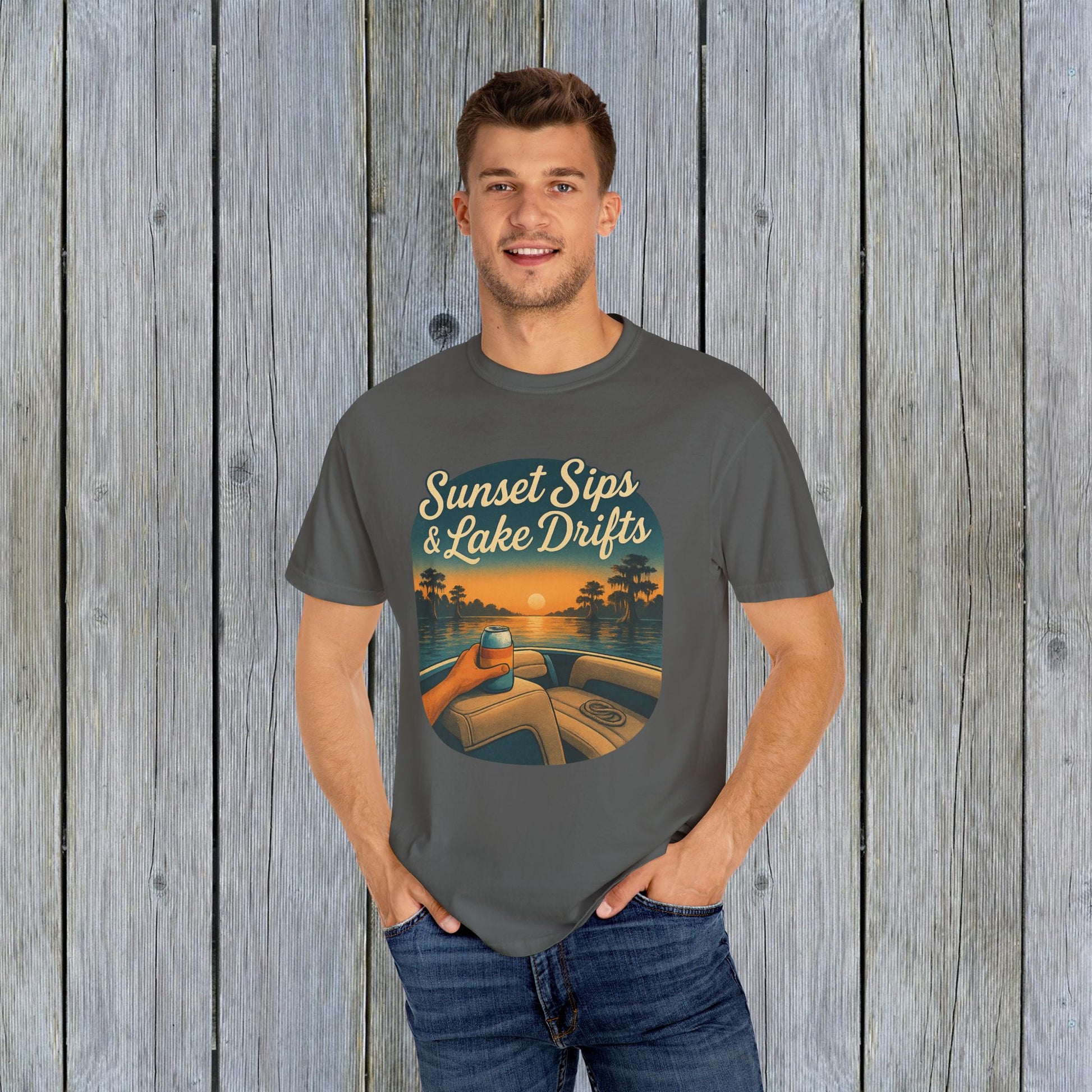 Model wearing the Lake Drifts T-Shirt in grey, highlighted by the 'Sunset Sips & Lake Drifts' design, ideal for relaxed summer days.