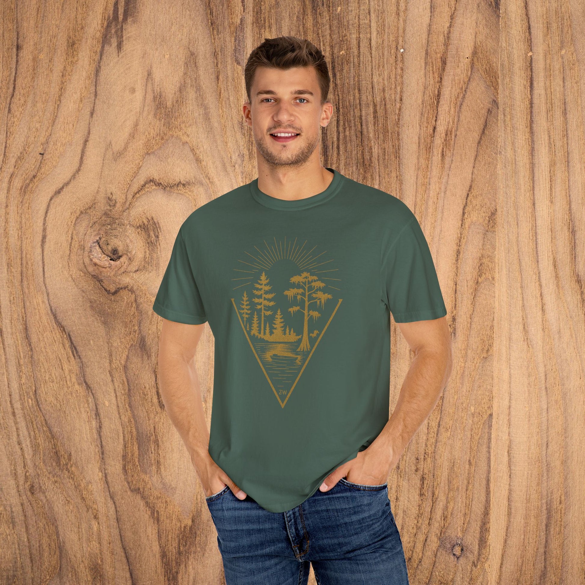 Nature Outdoor Vibes Tee in forest green, featuring a vibrant graphic of trees and sun rays, showcasing soft 100% US cotton material in a comfortable fit. Available in sizes S-4XL.