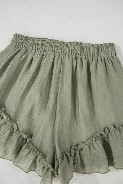 Textured Tie Waist Ruffle Hem Shorts in soft green fabric featuring a frill hem design, perfect for a stylish summer look.