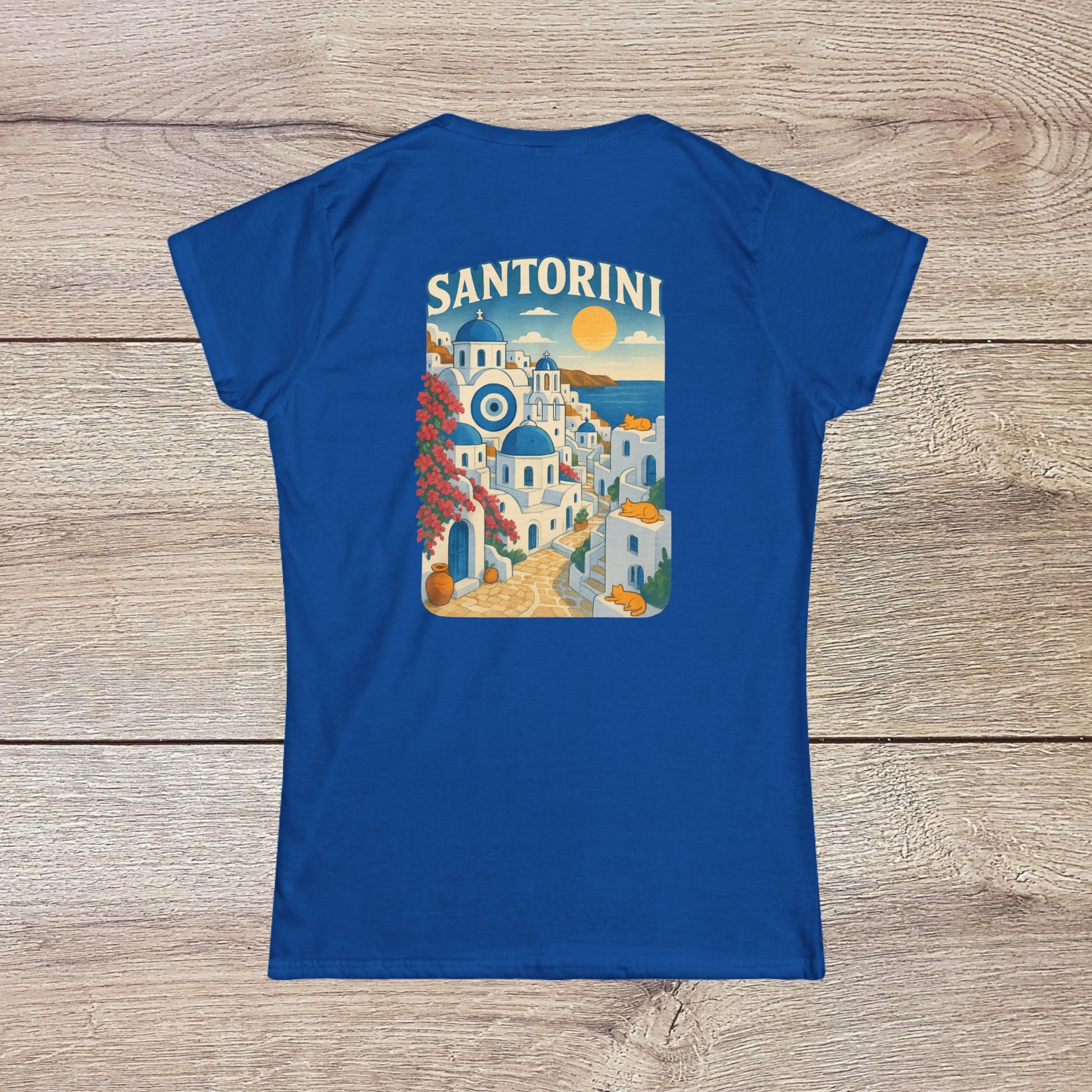 Santorini Tee - Back view of the tee in blue, highlighting a vibrant graphic illustration of Santorini, reflecting its eco-friendly and stylish design.