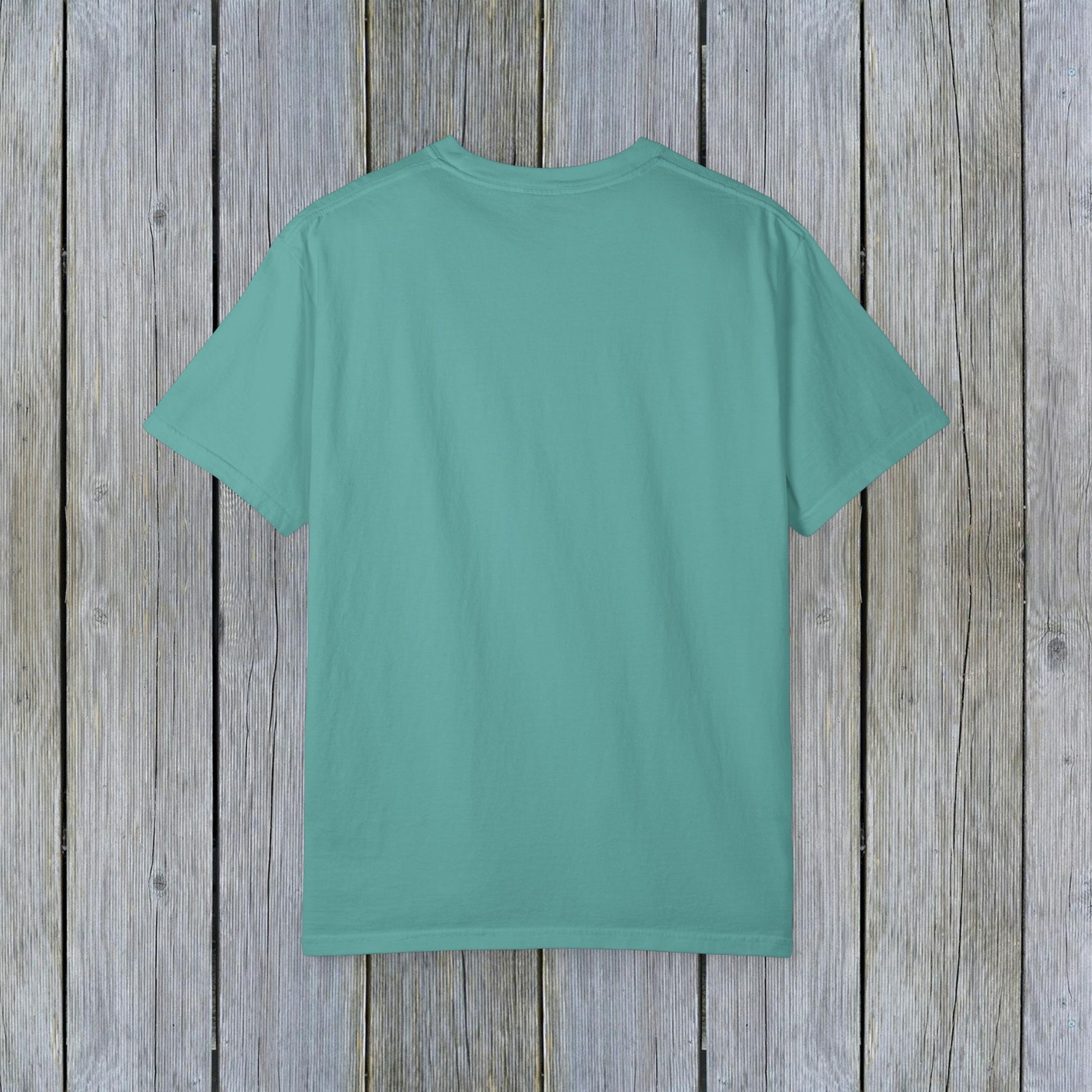 Back view of the Unisex Garment-Dyed Lake Rules Tee in a soft teal shade, designed for comfort and style in outdoor adventures.