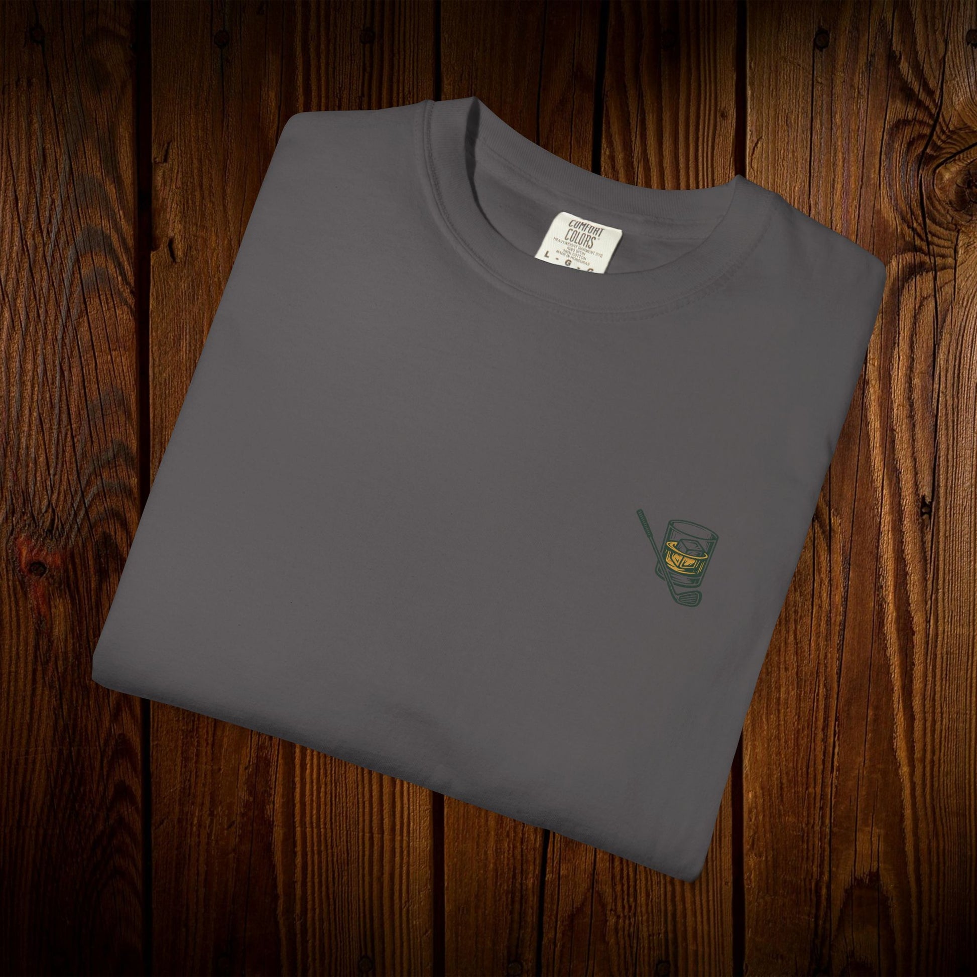 Men's Golf & Whiskey Tee in dark gray with a chic whiskey glass graphic, crafted from soft cotton and designed for eco-friendliness.