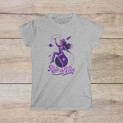 Vibrant Ride The Vibe Tee in grey showcasing a unique illustration of a woman riding a cosmic sphere, crafted from soft 100% ring-spun cotton.