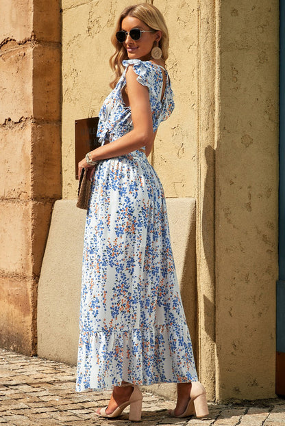 Floral Print Tie-Back Cropped Top & Maxi Skirt Set - Chic Summer Outfit featuring a model showcasing a vibrant floral design with ruffled sleeves and a flattering back tie, perfect for summer fashion.