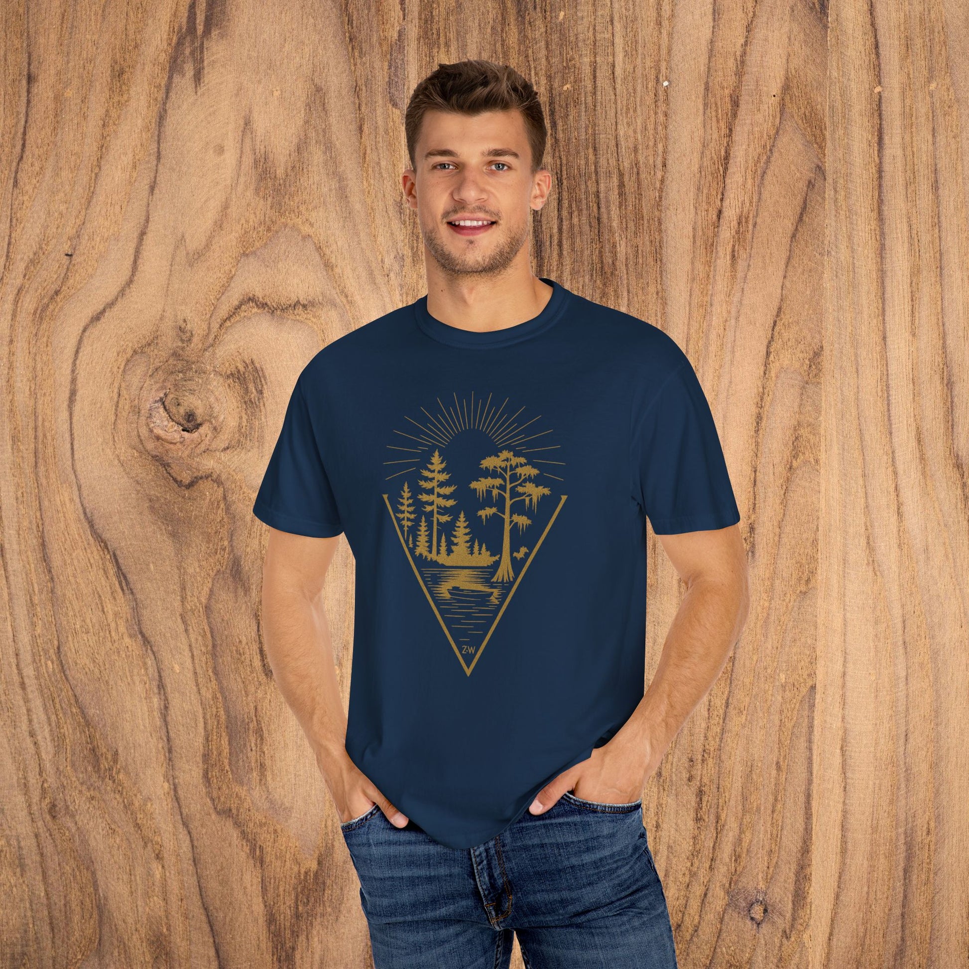 Happy young man wearing the Nature Outdoor Vibes Tee in navy, displaying a stylish forest design, made from soft 100% US cotton for lasting comfort, sizes S-4XL.