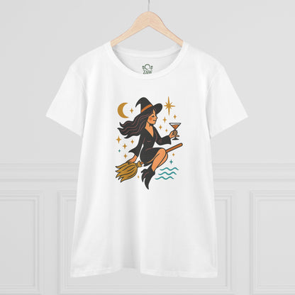 Witchy Night Out Tee - A stylish white t-shirt adorned with a whimsical illustration of a witch sipping a cocktail while flying on a broomstick.