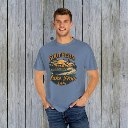 Southern Lake Flow T-Shirt worn by a model in a blue color, made from eco-friendly 100% US cotton, showcasing its stylish design.
