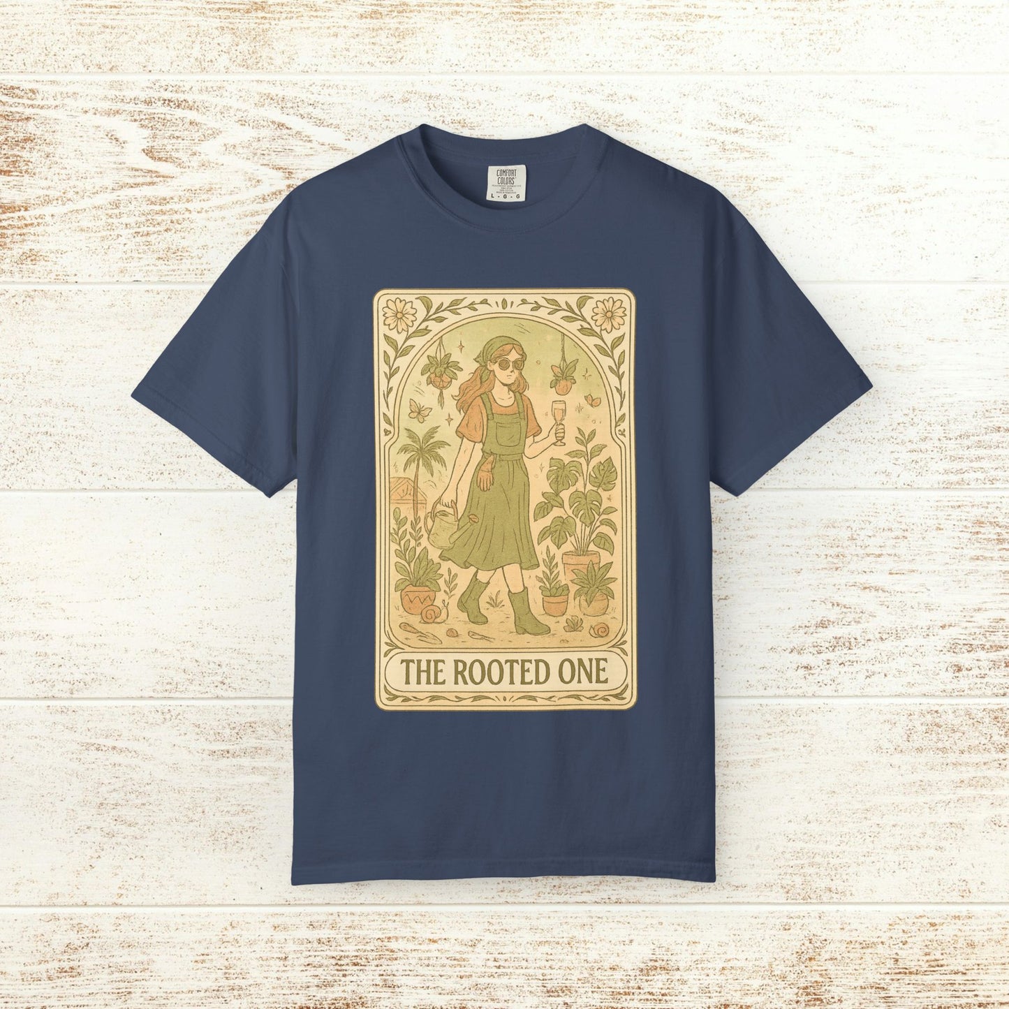 Rooted One Tarot Tee in navy color, featuring a unique tarot-inspired graphic of a woman surrounded by plants, made from ethically sourced cotton.