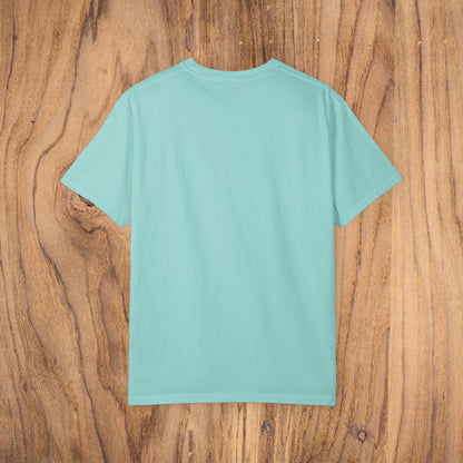 Back view of the Unisex Sunset Palm Tree T-Shirt in a soft aqua color, showcasing the comfortable garment-dyed fabric.