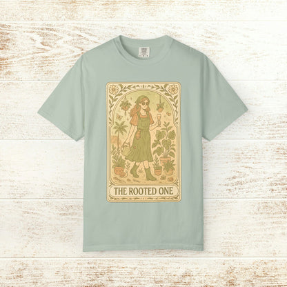 Rooted One Tarot Tee in mint color, highlighting a striking tarot-inspired illustration of a woman surrounded by plants, made from ethically sourced cotton.