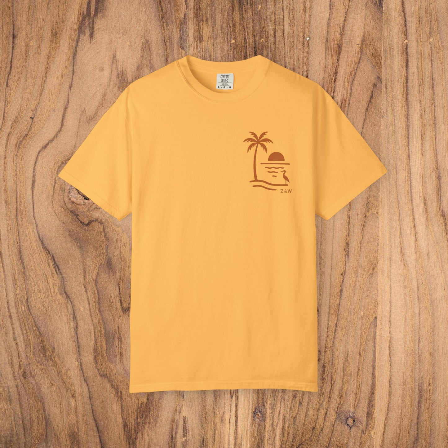 Unisex Sunset Palm Tree T-Shirt in warm yellow - vibrant garment-dyed cotton tee for men and women, ideal for summer festivals.
