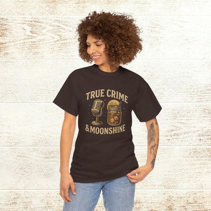 Model wearing the True Crime & Moonshine Unisex Graphic Tee with vibrant graphics, perfect for showcasing personal style at social gatherings.