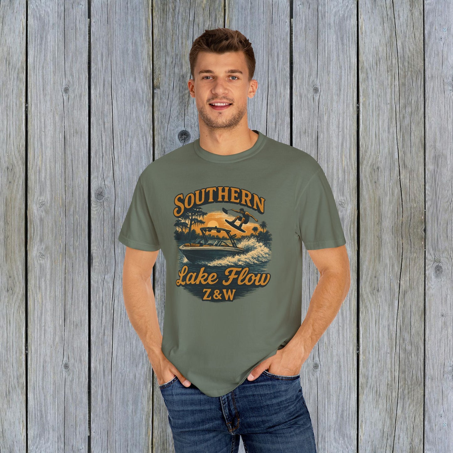 Man wearing Southern Lake Flow T-Shirt in olive green color, showcasing eco-friendly 100% US cotton material. Suitable for casual wear, featuring stylish lake-themed graphics.