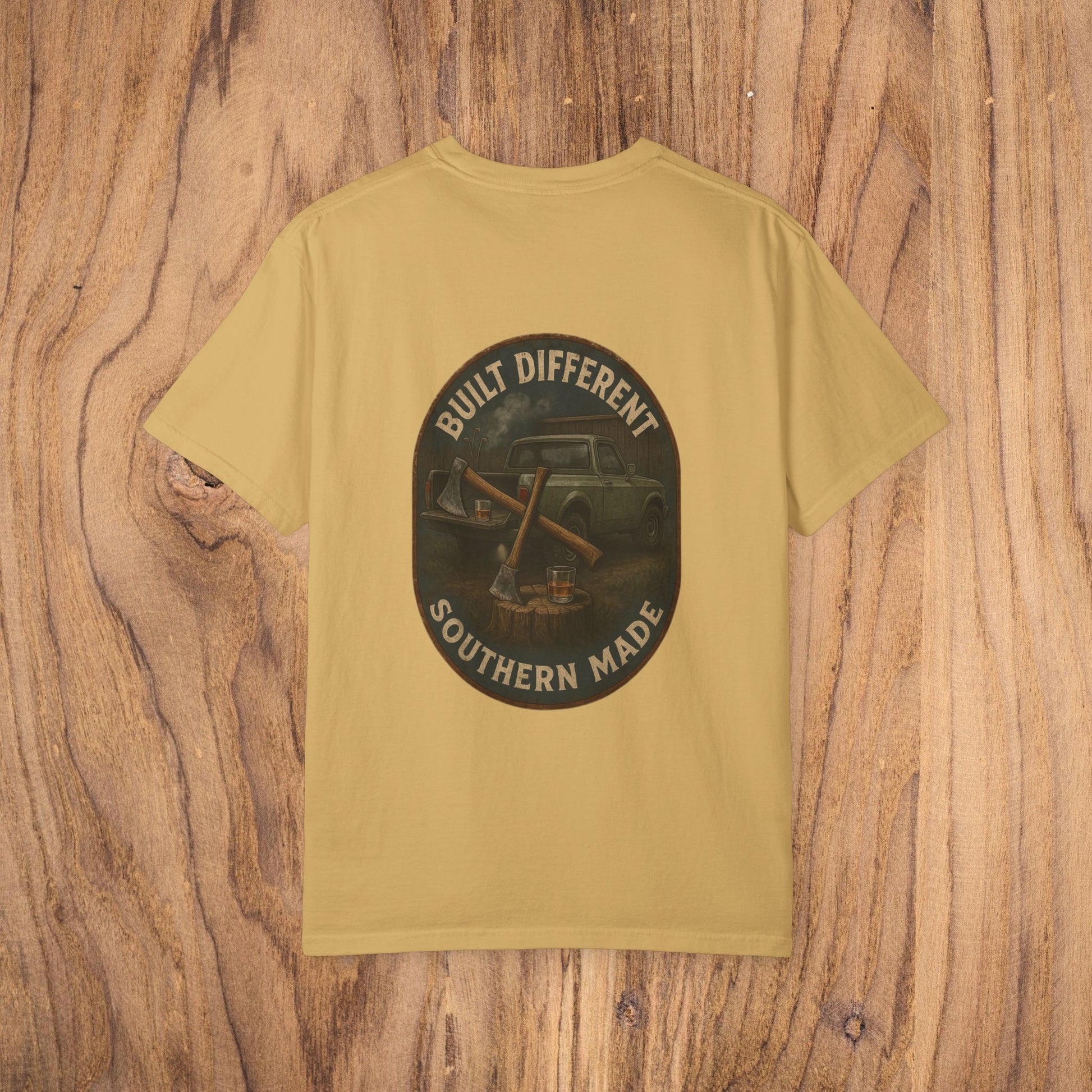 Back view of the Premium Southern Made T-Shirt in a mustard yellow color, featuring a bold graphic that reads 'Built Different Southern Made' on a dark circular design.