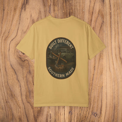 Back view of the Premium Southern Made T-Shirt in a mustard yellow color, featuring a bold graphic that reads 'Built Different Southern Made' on a dark circular design.