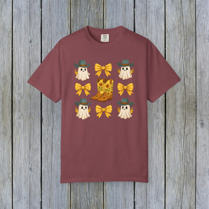 Cute Halloween T-Shirt featuring ghosts and cowboy boots, perfect for fall fashion. Made from eco-friendly fabric, this unisex tee is great for seasonal gatherings.