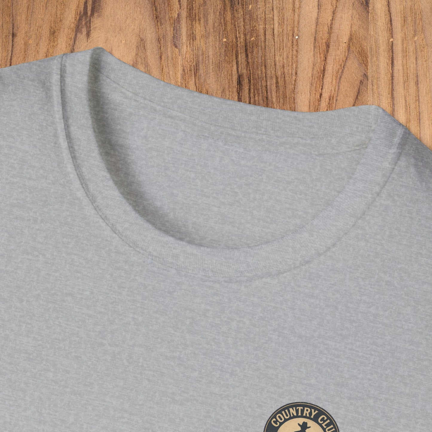 Close-up of the collar of the gray Vintage Southern Gentleman Golf Shirt, featuring a stylish neckline and the Country Club emblem.