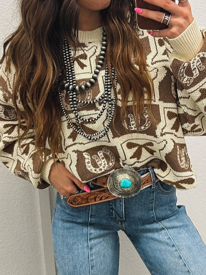 Trendy Graphic Round Neck Long Sleeve Sweater - Soft Viscose Blend with Stretch, featuring a stylish design, paired with high-waisted jeans and detailed with layered necklaces, perfect for casual attire.