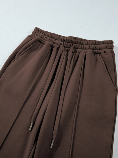 Detailed view of the high waist pants from the Trendsi Collared Sweatshirt & High Waist Pants Two-Piece Active Set - Soft Cotton Blend, featuring a drawstring and elastic waistband.