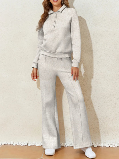 Trendsi Collared Sweatshirt & High Waist Pants Two-Piece Active Set - Soft Cotton Blend. Featuring a model posing in the versatile set, highlighting the drawstring pants.