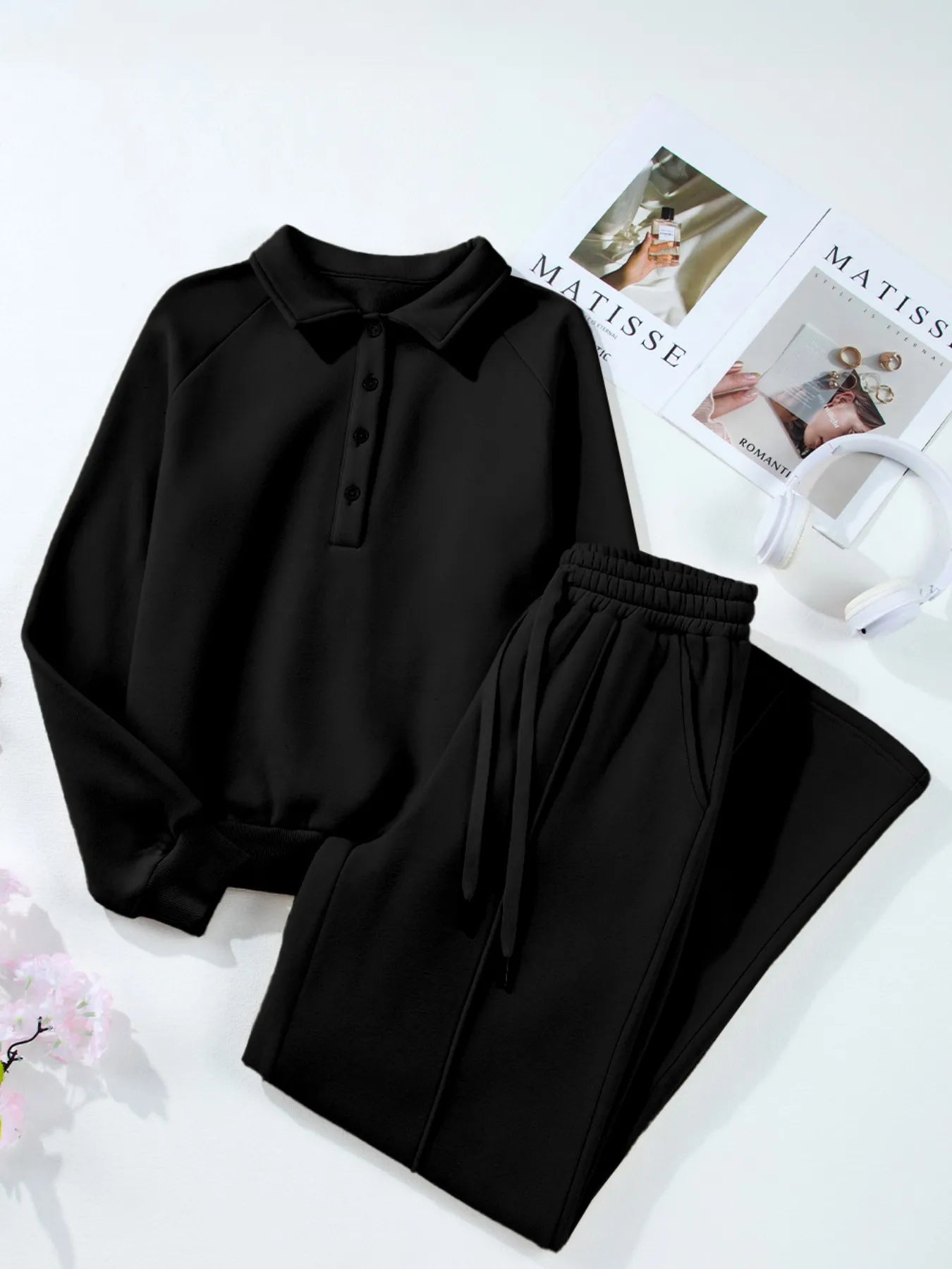 Flat lay of black Trendsi Collared Sweatshirt & High Waist Pants Two-Piece Active Set, highlighting the soft cotton blend fabric and trendy design.