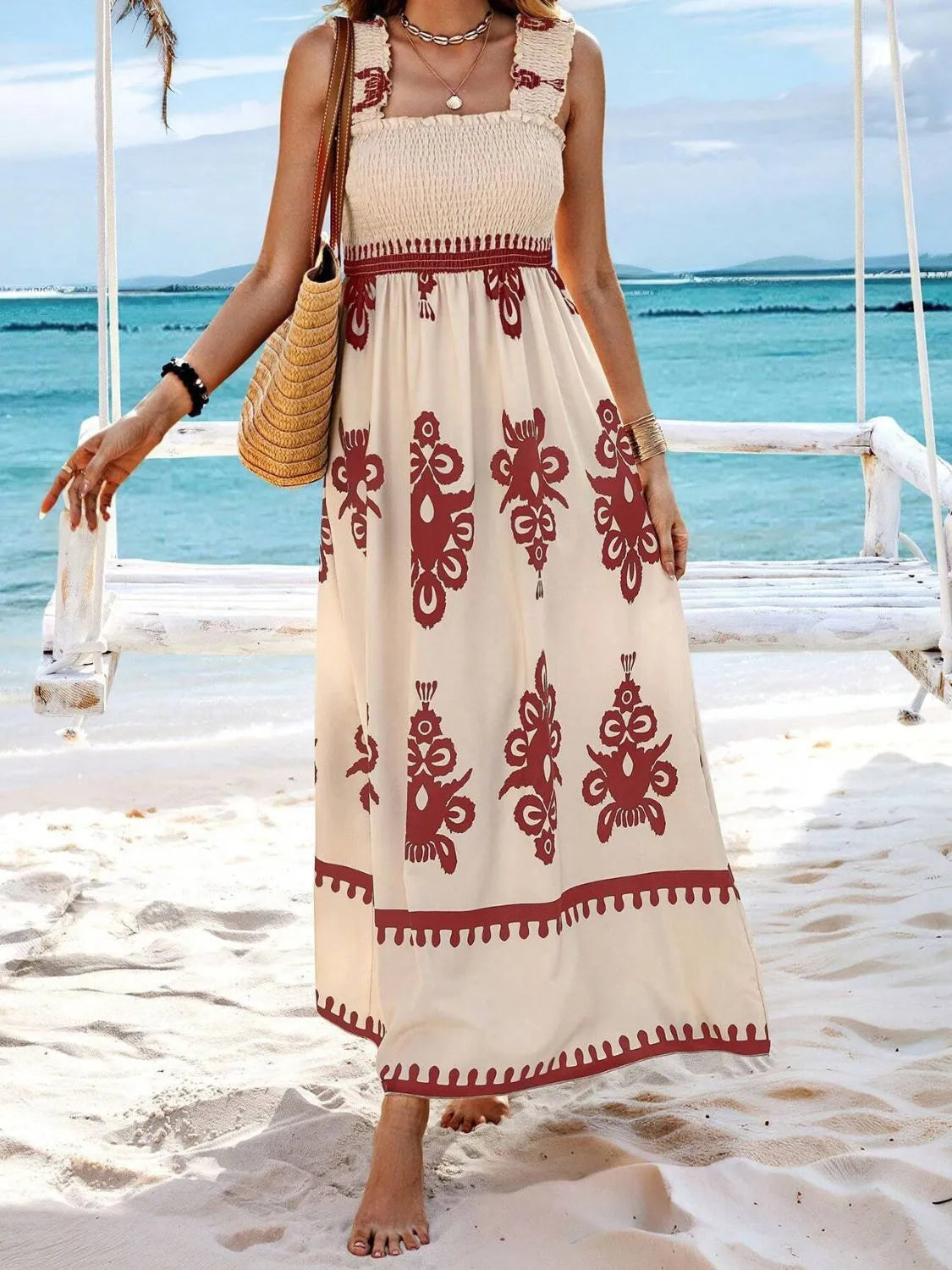 Trendsi Smocked Printed Maxi Dress with Wide Straps - Elegant Opaque, Non-Stretch Design, displaying an elegant look by the beach with a scenic backdrop.
