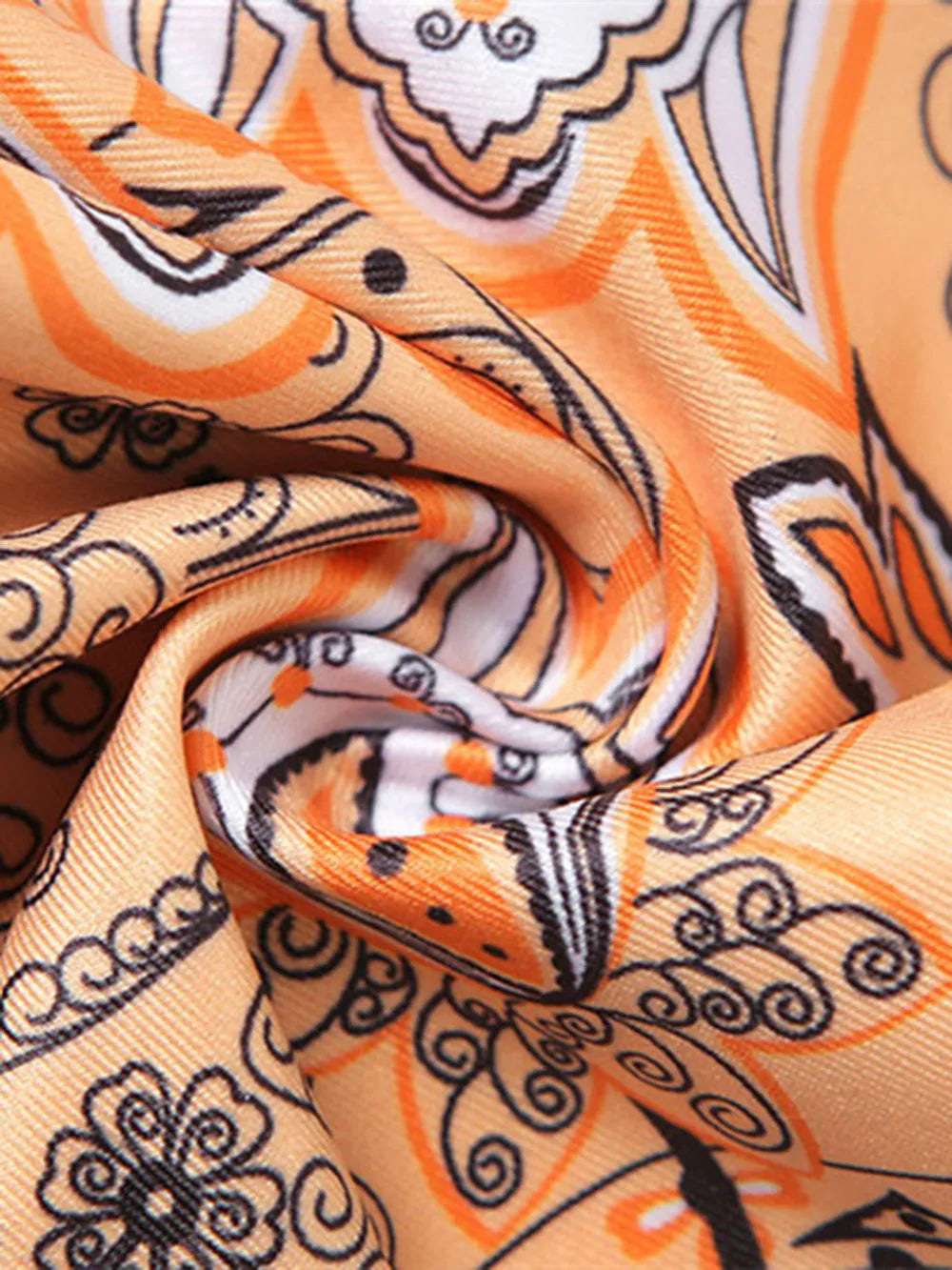 Close-up of the fabric texture of the Trendy Printed Halter Neck Cami Top, revealing its softness and vibrant print, designed for comfort and style.