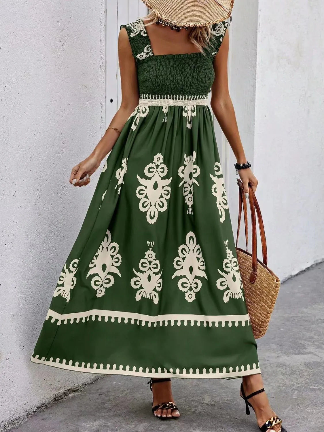 Trendsi Smocked Printed Maxi Dress with Wide Straps - Elegant Opaque, Non-Stretch Design, worn by a woman in a chic green version, standing against a minimalist wall.