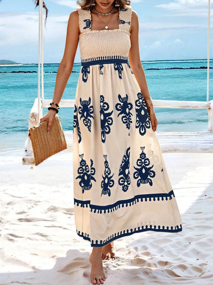 Trendsi Smocked Printed Maxi Dress with Wide Straps - Elegant Opaque, Non-Stretch Design, captured in a beach environment, featuring a navy design with ornate prints for a chic summer look.
