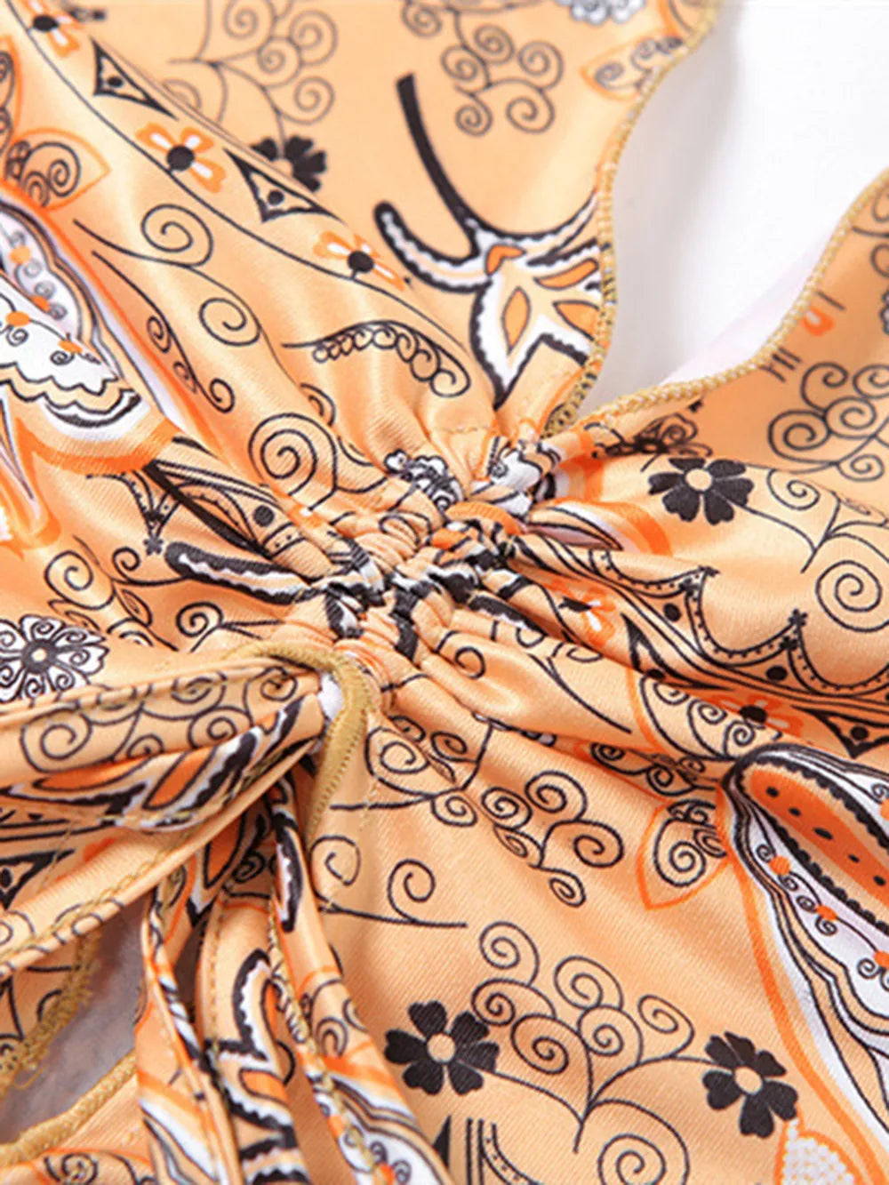 Detailed view of the center ruching on the Trendy Printed Halter Neck Cami Top, showcasing its stylish design and structure.