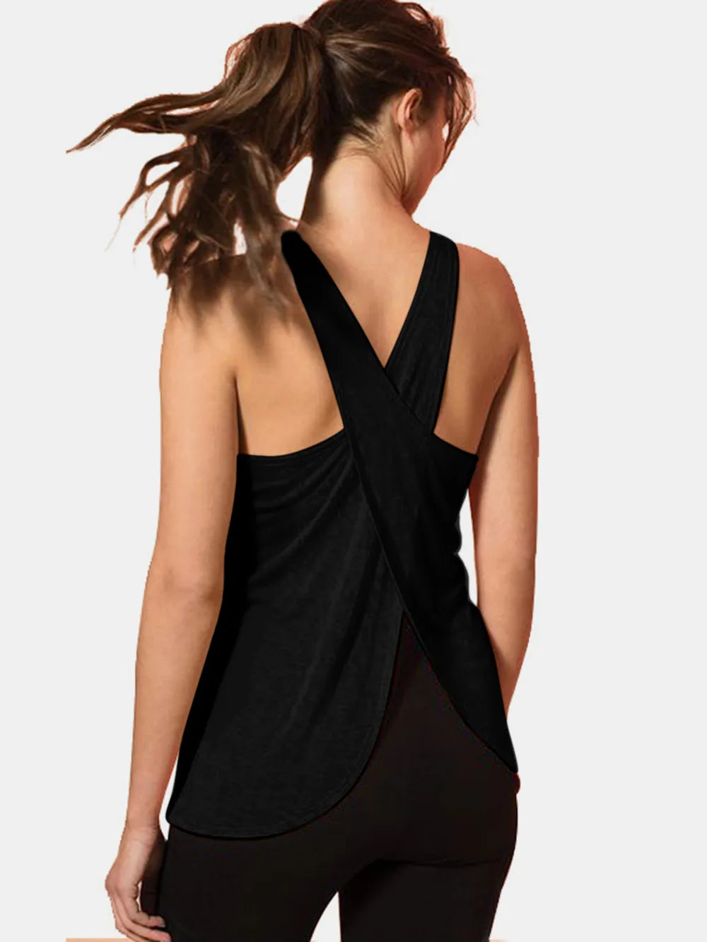 Model wearing the Crisscross Scoop Neck Tank Top for Active Wear in black, highlighting its flattering fit and stylish design, ideal for gym use.