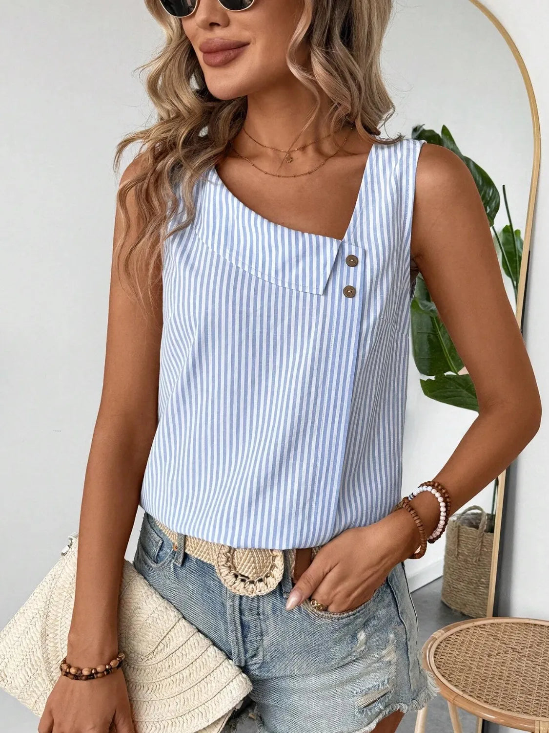 Front view of the Asymmetrical Striped Tank with Decorative Buttons for Women, featuring a stylish blue striped pattern and decorative buttons, perfect for a chic summer outfit.