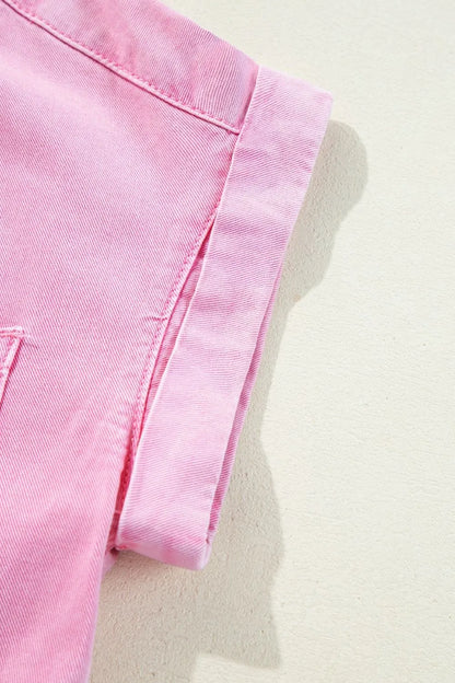 Detail of the rolled sleeve hem on a Button Down Short Sleeve Denim Dress with Pockets, highlighting the trendy style and fabric type.