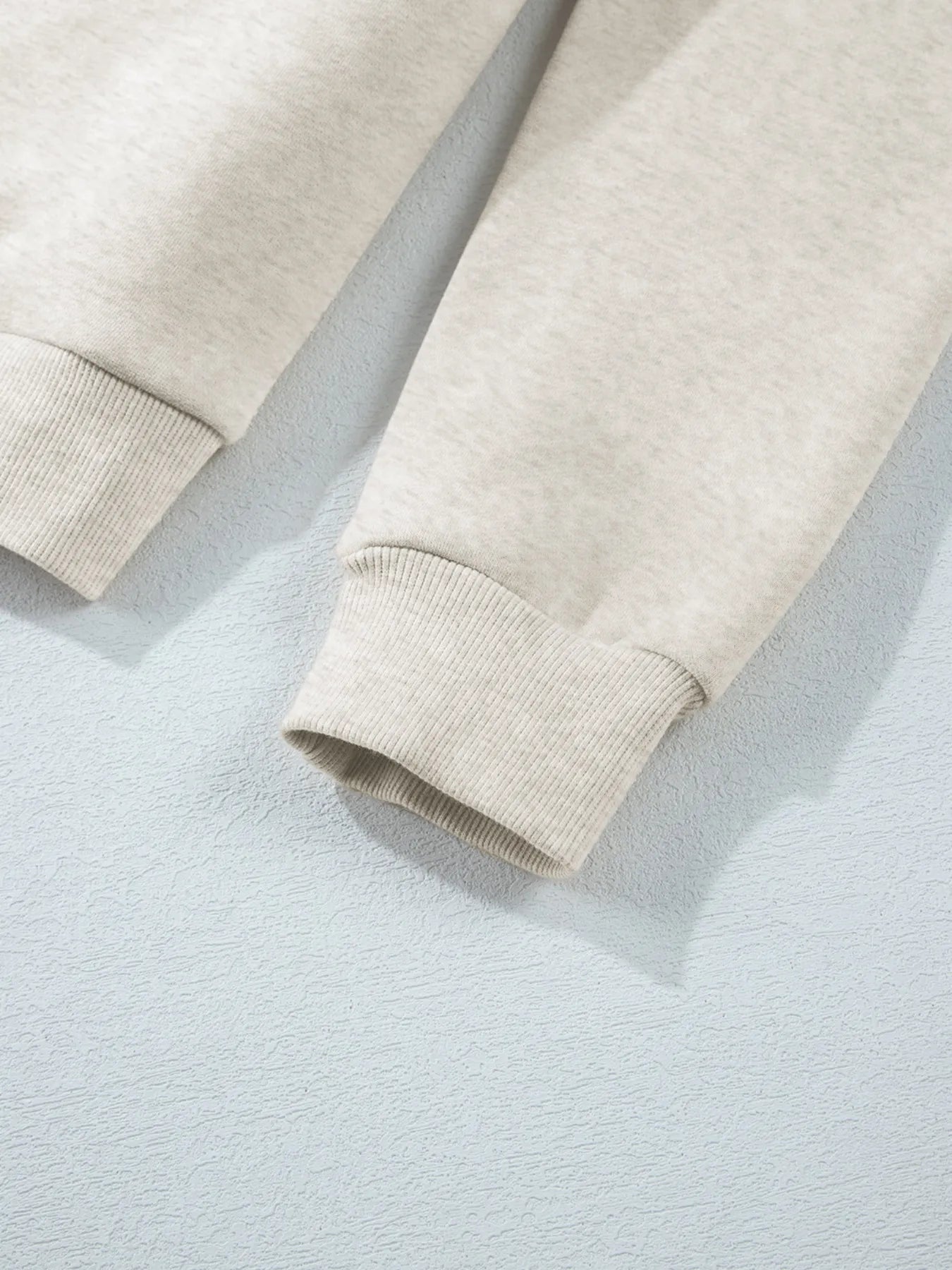 Detail of the sleeve cuff on the Trendsi Collared Sweatshirt - Soft Cotton Blend.