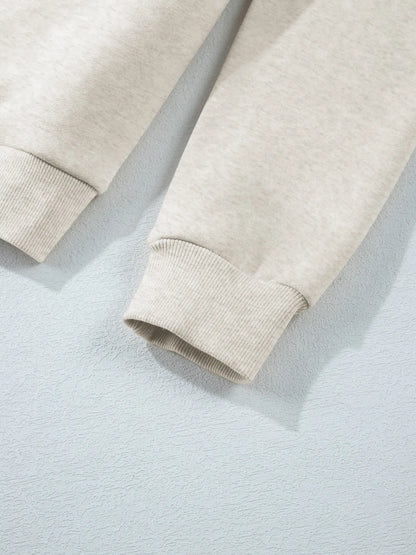 Detail of the sleeve cuff on the Trendsi Collared Sweatshirt - Soft Cotton Blend.