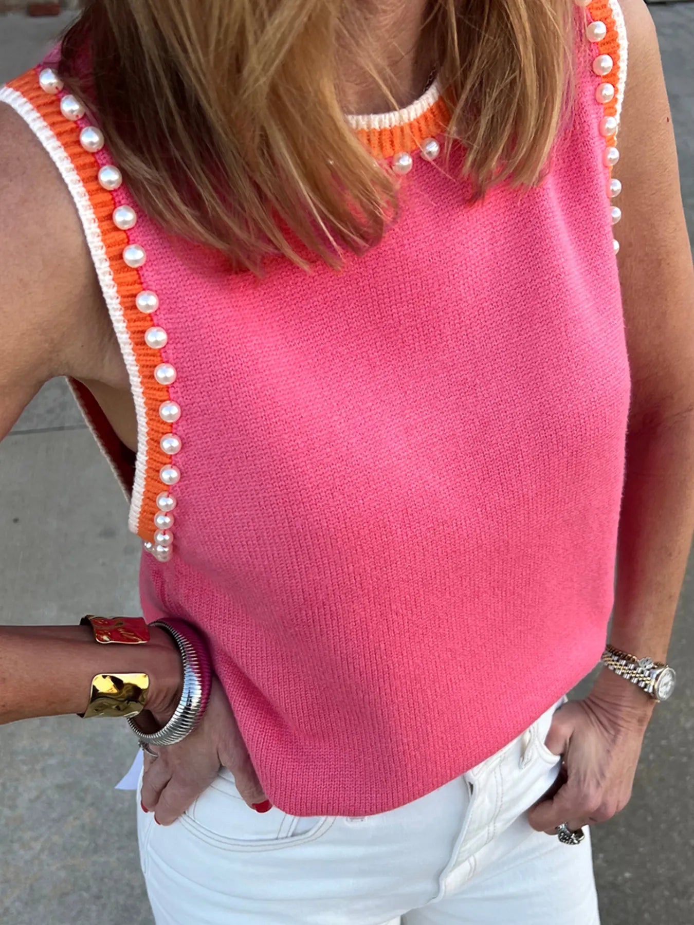 Stylish Contrast Trim Pearl Detail Sweater Tank Top featuring a vibrant pink color, pearl detailing, and an orange contrast trim, worn by a model showcasing a trendy summer look.