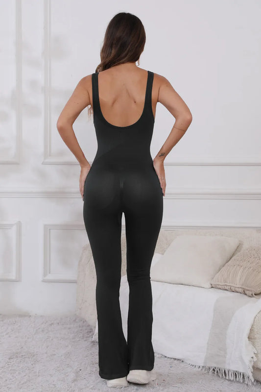Back view of the Scoop Neck Wide Strap Active Jumpsuit with Moderate Stretch in black, highlighting its stylish design and perfect for active lifestyles.