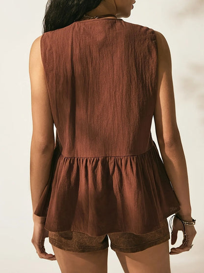 Back view of Trendsi Bow-Tie Peplum Tank Top with Ruched Detail, showcasing the slightly stretchy 100% polyester fabric and peplum design.