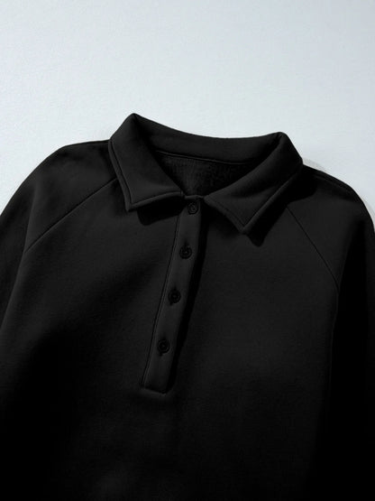 Close-up of the collared sweatshirt from the Trendsi Collared Sweatshirt & High Waist Pants Two-Piece Active Set, emphasizing the button detail and fabric texture.