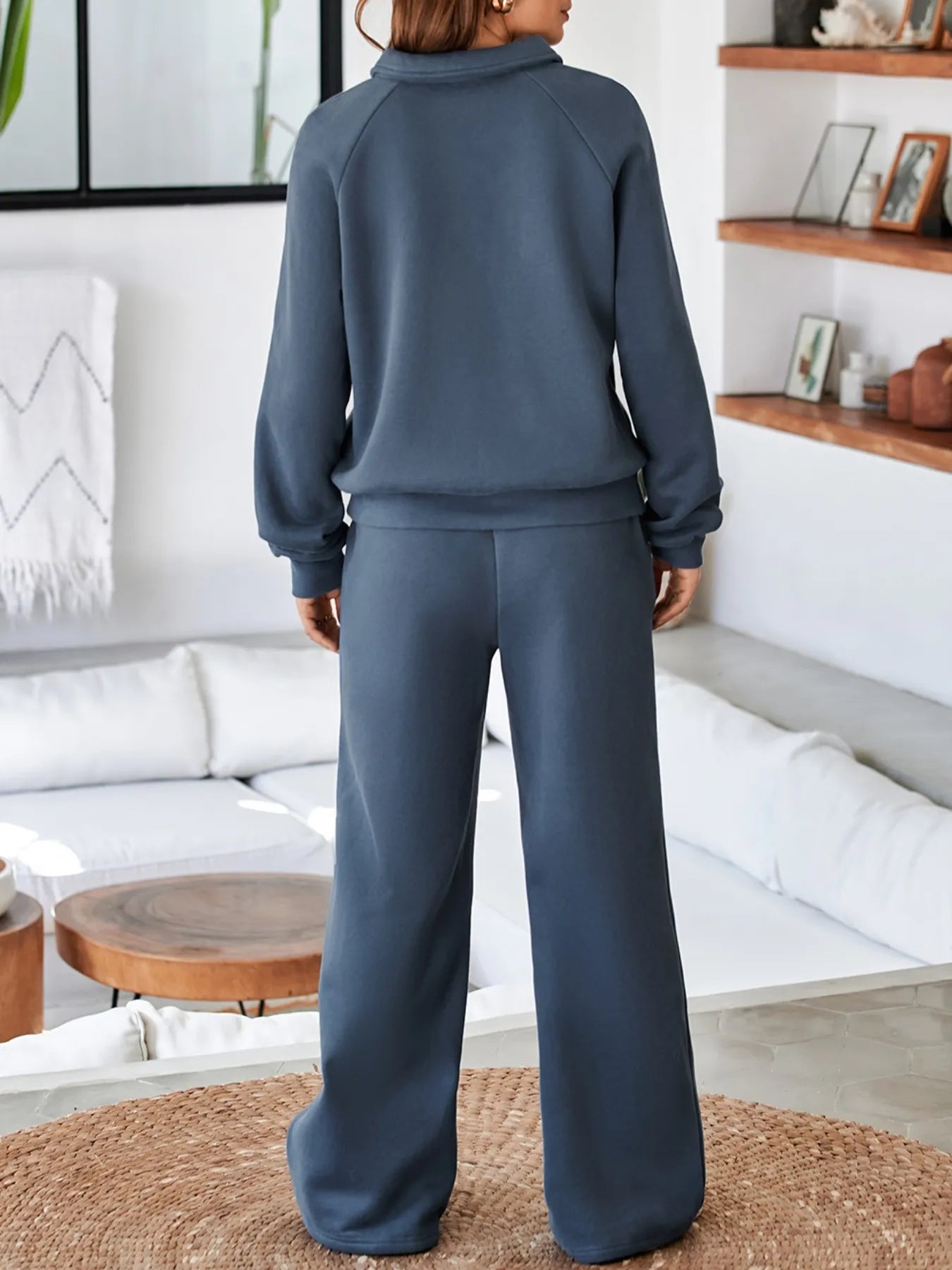 Back view of the model wearing the Trendsi Collared Sweatshirt & High Waist Pants Two-Piece Active Set - Soft Cotton Blend, showing the relaxed style and perfect fit.