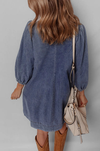 Back view of the Tie Neck Long Sleeve Mini Denim Dress, highlighting its relaxed fit and soft denim fabric.