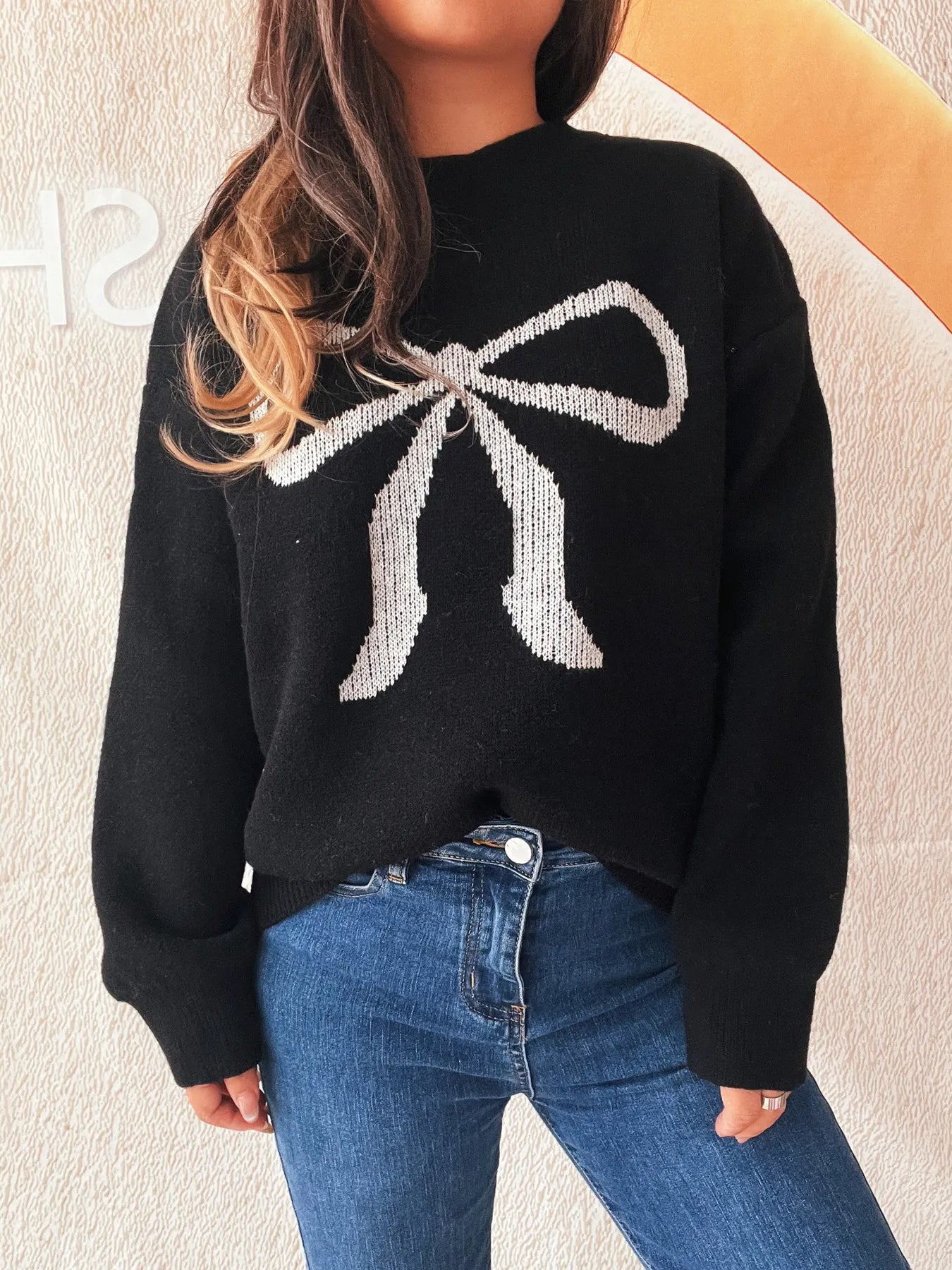 Front view of the Stylish Bow Pattern Casual Long Sleeve Sweater for Effortless Everyday Wear, showcasing its unique bow graphic and relaxed fit.
