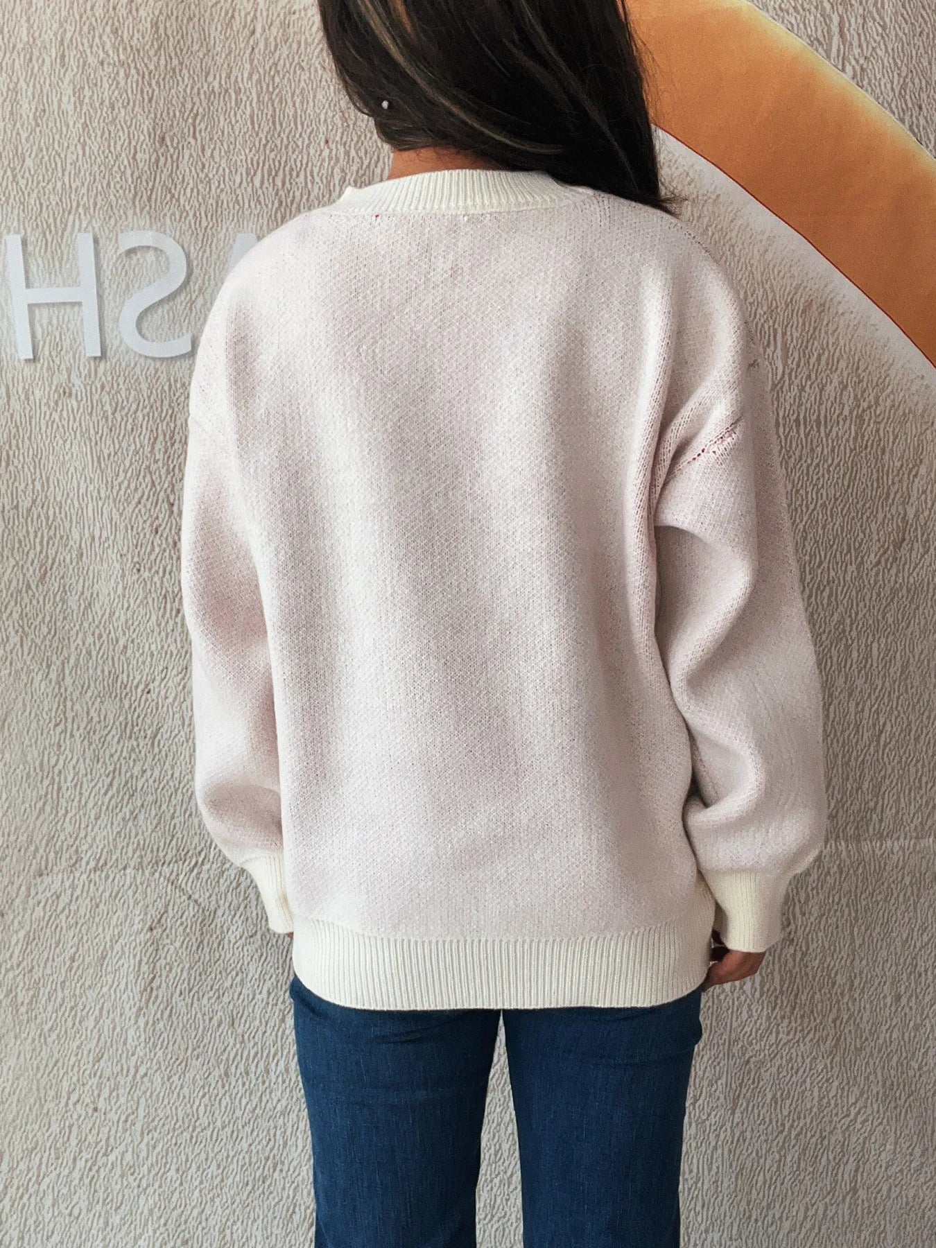 Stylish Bow Pattern Casual Long Sleeve Sweater for Effortless Everyday Wear, featuring the back view of a light pink sweater, perfect for layering during casual outings.