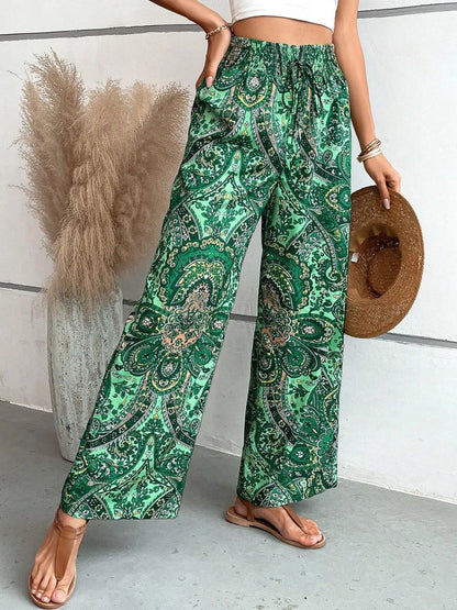 Back view of the Trendy Printed Wide Leg Pants with Tied Detail, featuring an exquisite green paisley print, suitable for fashionable outings and daily wear.