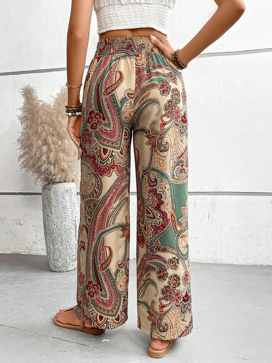 Trendy Printed Wide Leg Pants with Tied Detail - Back view of model showcasing the colorful, wide leg pants with a tied detail, made from 100% opaque polyester, perfect for versatile styling.