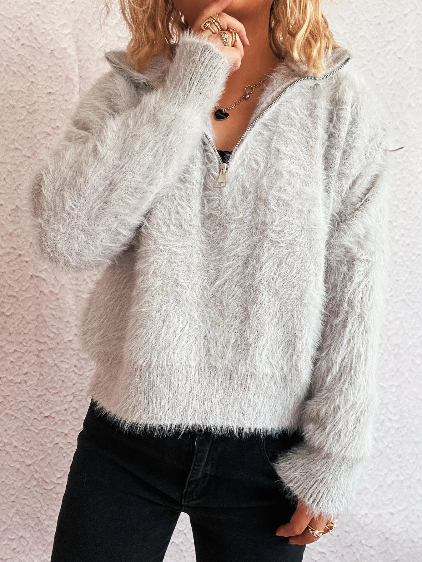 Cozy Fuzzy Half-Zip Sweater for Women displayed in light gray, showcasing its fluffy texture and comfortable design, ideal for stylish warmth during the cooler months. Made from 100% polyester and easy to care for.